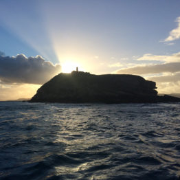 The sun setting over Puffin Island